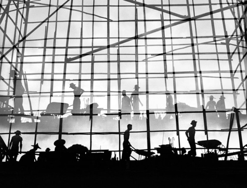 Silhouetted construction workers in Hong Kong